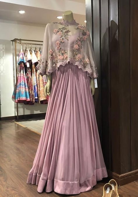 Beautiful Satin-Silk Skirt Lehenga.  Paired with inner blouse and crop top jacket. Embellished with hand embroidery work with zardose and resham work. Stylish with modern silhouettes and traditional embellishments. #dress #silhouettes #indowestern #Gown #Lehenga #Asmairaa #trendy #festival Indowestern Gown, Gown Lehenga, Skirt Lehenga, Indowestern Gowns, Hand Embroidery Work, Indian Wedding Gowns, Crop Top Jacket, Resham Work, Indian Gowns Dresses