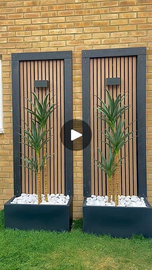 18K views · 5K reactions | Build DIY decorative planters with us using @volgapanels 🔨

I thought that this side of our garden was missing something, so we decided to turn this empty wall into a little feature.

We used simple rectangular planters as a base. We then installed 3 x Volga Panels in the centre of each planter to create a slatted effect backing. We then proceeded to build a frame using  some spare composite posts that we had from our recent garden renovation. Lastly, we put the plants in, filled the plant pots with white pebbles and added solar up & down wall lights to finish the look and TA DAAA ! 

Simple, but so effective! 

We went for the Natural Oak Slat Wall Panels from @volgapanels They are 100% waterproof, moisture proof, weatherproof, therefore they can be used both i Garden Rendered Wall, Outdoor Feature Wall Ideas, Oak Slat Wall, Brid House, Garden Wall Ideas, Outdoor Wall Panels, Garden Renovation, Garden Wall Designs, Build A Frame