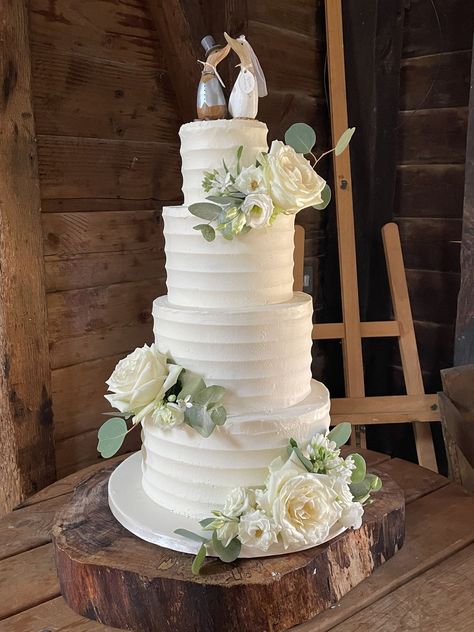 Fresh summery looking wedding cake - 4 tier buttercream frosted with ridged lines and clusters of fresh roses, liaianthus and foliage - couple's own bride & groom geese toppers 4 Tier Wedding Cake, Buttercream Roses, 3 Tier Wedding Cakes, Wedding Cake Roses, Buttercream Wedding Cake, Tiered Wedding Cake, Sugar Flowers, Buttercream Frosting, Cake Inspiration