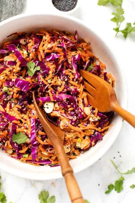 You'll love this healthy Carrot Slaw recipe! Such an easy, cold recipe loaded cabbage, carrot, quinoa and almonds and finished in a creamy sesame dressing! #carrotslaw #healthycoleslaw #vegancoleslaw #summerside Slaw For Pulled Pork, Carrot Slaw Recipe, Summer Bbq Side Dishes, Healthy Coleslaw, Easy Summer Side Dishes, Red Cabbage Slaw, Carrot Slaw, Vegan Coleslaw, Bbq Side Dishes