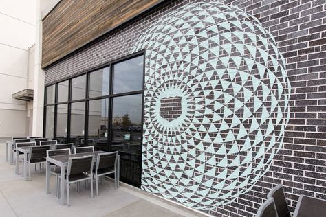 We did a project in 2017 with Mod Pizza, where the best Salt Lake City mural artists were put to the test. They hand painted painted a very intricate mandala on a brick wall just south of Salt Lake City, Utah. This exterior mural is located at the Mod Pizza branch by Fashion Place Mall in Murray City.  Check out more photos from the project on our website or give us a ring at 646-801-6024 to chat about mural projects! Mod Pizza, City Mural, Hand Painted Mural, Design For Restaurant, Exterior Murals, Painted Mural, Sign Painter, Intricate Mandala, Design Club