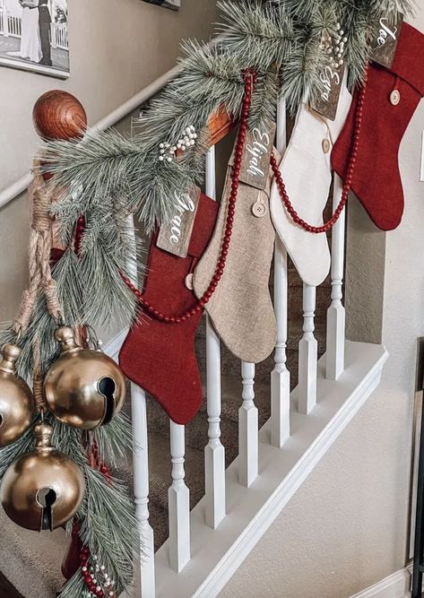 No Fireplace? No problem. Try These 20 Creative Christmas Stocking Hanging Ideas — ASHLINA KAPOSTA Stockings On The Stairs, Stockings On Stairs With Garland, Christmas Stocking Tree, Stockings Hung On Stairs, Christmas Stockings No Fireplace, Christmas Decor Ideas For Staircase, Christmas Stocking Hanging Ideas, Stockings On Staircase, Stocking Hanging Ideas