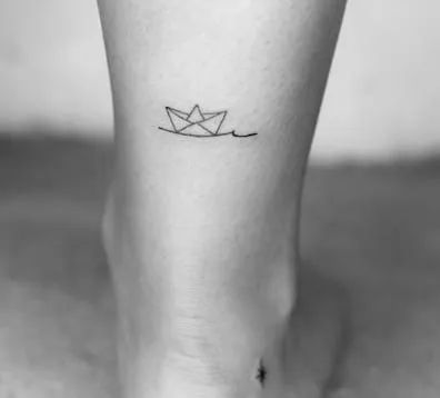 50 Outstanding Boat Tattoo Ideas that You Have To Notice! - Tattoo Twist Small Boat Tattoo For Women, Small Sailing Tattoo, Boating Tattoo Ideas, Paper Boat Tattoo Design, Small Boat Tattoo Simple, Tiny Ship Tattoo, Tiny Boat Tattoo, Fine Line Boat Tattoo, Origami Boat Tattoo