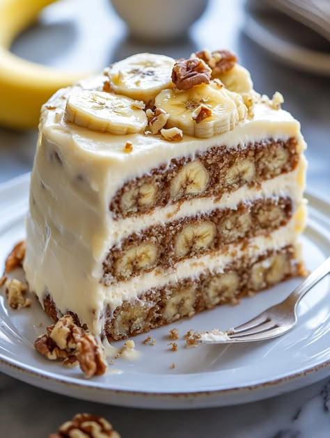 Walnut Banana Cream Cake 🍌   🍌 𝗜𝗻𝗴𝗿𝗲𝗱𝗶𝗲𝗻𝘁𝘀 🍌 2 ½ cups all-purpose flour 1 ½ cups granulated sugar 1 tsp baking powder 1 tsp baking soda ½ tsp salt 1 cup unsalted butter, softened 4 ripe bananas, mashed 2 large eggs 1 tsp vanilla extract 1 cup buttermilk 1 cup chopped walnuts For the Cream Cheese Frosting: 8 oz cream cheese, softened ½ cup unsalted butter, softened 1/2 cups powdered sugar 2 tsp vanilla extract 2-3 tbsp heavy cream (optional) Banana Filling For Cake, Banana Snack Ideas, Banana Energy Bites, Peanut Butter Banana Recipes, Banana Cream Cake, Banana Filling, Banana Birthday, Banana Energy, Amaury Guichon