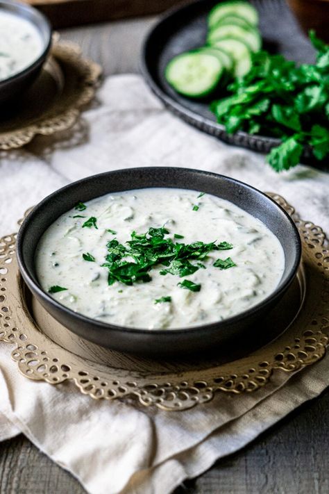 A cooling Indian yogurt-based dip that is the perfect balance to your spicy dishes. This easy cucumber raita makes a refreshing side to your Indian meal or snack! #cucumberraita #raita #indianfood Indian Yogurt Sauce, Cucumber Raita Recipe, Vegetable Samosa, Raita Recipe, Peanut Curry, Cilantro Chutney, Cucumber Raita, Indian Meal, Cucumber Yogurt