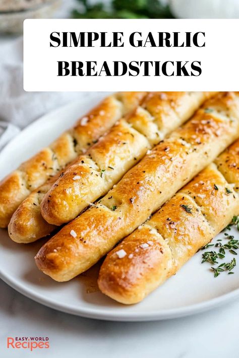 Indulge in the captivating aroma of freshly baked, soft garlic breadsticks that will permeate your space with warmth and comfort. These homemade delights are crafted to perfection, boasting a tender and airy texture that complements the rich flavors of garlic-infused butter. Enhance any meal with this mouthwatering side dish that promises to satisfy cravings and leave a lasting impression on anyone lucky enough to enjoy it. Garlic Breadsticks Recipe, Homemade Garlic Bread Recipe, Italian Snacks, Breadsticks Recipe, Italian Recipes Appetizers, Butter Making, Garlic Rolls, Make Garlic Bread, Gluten Free Yeast Free