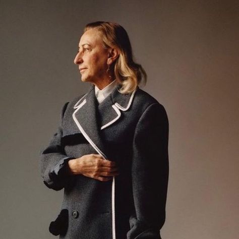 What Miuccia wore on Instagram: "When worn inside, last post’s winter outfit becomes ready for work place (if you work at Prada, that is). Wearing coat as dress is one of Miuccia’s signature. In this Jamie Hawkesworth picture she pairs it with bare legs, a men’s shirt and stilettos for that recognizable clic-clac sound on concrete floors. #miucciaprada #office" Jamie Hawkesworth, Miuccia Prada, S Signature, Prada, Winter Outfits, How To Wear