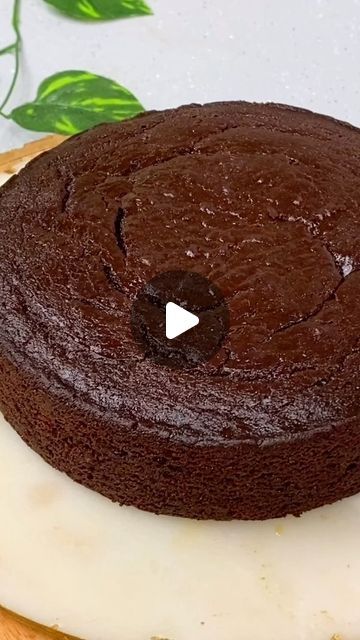 Priya Taparia - Flavourful Food on Instagram: "✨Easy Chocolaty Cake✨- Soft & Moist Chocolaty Eggless Wheat Cake Amazing texture too.  MUST TRY💕  Ingredients: Measurement cup – 200 ml = 130 gms  Wet ingredients : Fresh curd – 3/4th cup Brown sugar/refined sugar -1/2 cup Caster/refined sugar – 1/4th cup Vanilla essence – 1 tsp Dark Cooking chocolate – 1/4th cup melted Refined oil/melted salted butter – ½ cup  Dry ingredients:  Wheat flour(Atta) - 1 cup Cornflour/Custard powder – 1 tbsp Cocoa powder - 1/4th cup Baking powder – 1 tsp Baking soda – 1/4th tsp Salt – a pinch  Milk - 1/4th cup Hot water – 3 tbsp Instant coffee powder – 1 tsp  Method: 1. Combine the wet ingredients as shown in video. 2. Sieve the dry ingredients ingredients & add in the wet ingredients. 3. Add milk & coffee concoc Wet Chocolate Cake Recipe, Wet Cake, Easy Chocolate Cake Recipe 4 Ingredients, Chocolate Cake Recipe Without Eggs, Chocolate Cake Recipe Videos, Eggless Moist Chocolate Cake, How To Make Eggless Cake At Home, Eggless Mud Cake Recipe, Cake Recipes Eggless Without Oven