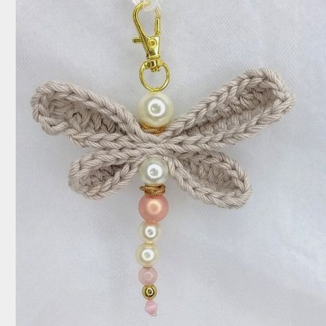 This handcrafted dragonfly keychain features pink pearls and a crochet bag clip. It is made with high-quality materials and is perfect for adding a touch of whimsy to your keys or.#crochetkeychain #handmadegifts #DIYkeychain #crochetlove #keychainaddict Dragonfly Crochet, Crochet Dragonfly, Crochet Lanyard, Dragonfly Keychain, Charm Crochet, Car Hanging Accessories, Sales Ideas, Crochet Keychains, Beaded Dragonfly