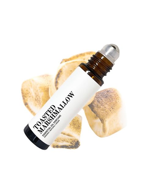 All natural and organic Toasted Marshmallow Perfume Oil is a great fragrance to wear for anyone looking for a cozy and sweet scent to wear. HOW IT SMELLS This perfume has a delicious sweet vanilla aroma with a hint of woody and spice notes. INGREDIENTS  Fractionated coconut oil, vanilla, cinnamon, nutmeg and cedarwood essential oils. PRODUCT PACKAGING This product is made in a 10mL glass bottle with a stainless steel roller ball and plastic cap. HOW TO USE Roll on wrist, temples, back of the nec Roll On Perfume Oil, Cinnamon Perfume, Marshmallow Roll, Marshmallow Perfume, Body Oil Perfume, Roller Perfume, Candy Perfume, Fragrance Lab, Organic Perfume