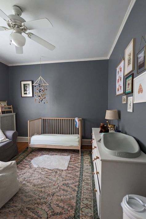 Dana and Andy first fell in love with this condo's vintage charm, and have appreciated all the work they did to make the space a comfortable home for their family, which now includes a young son. "Our condo has been a wonderful, cozy refuge," Dana writes. Nursery With Dark Wood Floors, Nursery With Gray Walls, Gray Walls Nursery, Grey Walls Nursery, Nursery With Gray Crib, Grey Wall Nursery, Nursery Grey Walls, Long White Dresser, Dark Grey Nursery