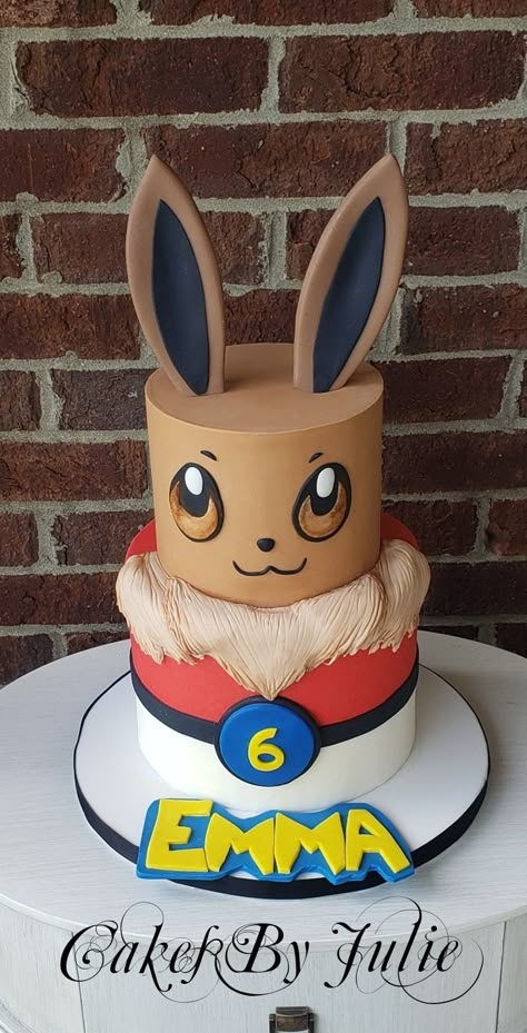 Evie pokemon cake Pokemon Cake Evie, Evie Cake Pokemon, Evee Pokemon Cake, Evee Cake Ideas, Evee Birthday Cake, Pokemon Cake Birthday, Eevee Birthday Cake, Pokémon Cakes, Pokemon Cakes