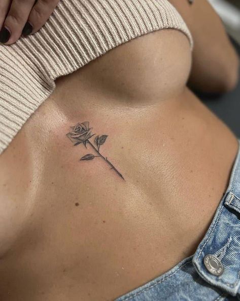 24 Fiery Middle Chest Tattoos For Females To Try Right Now 20 Middle Tattoos For Women, Tattoo Ideas Female V Line, Women’s Small Chest Tattoo, Sternum Rose Tattoo Women, Tatto In The Middle Of Chest Women, Tats In Between Chest, Tats On Chest, Rose Tattoo On Chest Female, Tattpp Ideas Woman