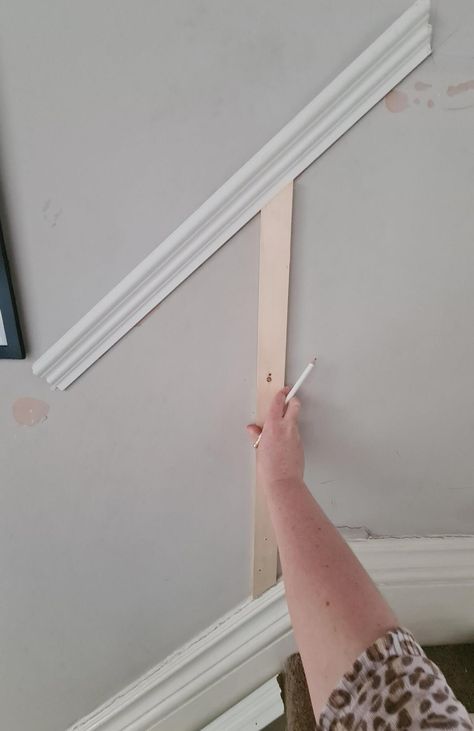 Looking for how to install wall panelling? This tutorial how to add wainscoting to your hallway is easy to follow and will help you panel your staircase with ease. Check out my nifty hack for working out the angles to cut! Read more now. Stair Panels Stairways, Panelling For Stairs, Wall Paneling Up The Stairs, How To Do Panelling Up The Stairs, Hall Stairs And Landing Decor Panelling, Hall And Stairs Panelling Ideas, Staircase Design Panelling, Panelled Wall Staircase, Panelling Up The Stairs Hallway