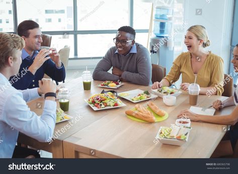 Happy business colleagues having lunch on table at office cafeteria royalty free images photo Office Photoshoot, Office Shoot, School Moodboard, Corporate Lifestyle, Casual Photoshoot, Office Cafeteria, Employee Satisfaction, Working Table, Lifestyle Photoshoot