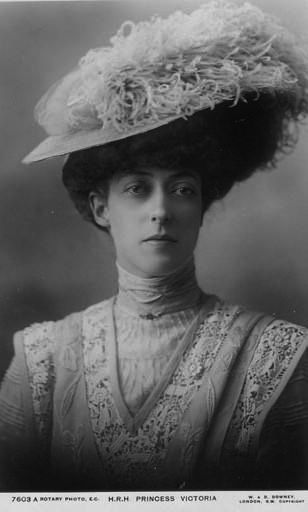 Princess Victoria wears an ostrich-plumed hat and a dramatic dress with two vee-shaped lace panels paralleling each other in this photo. She was a full time companion to her mother, Queen Alexandra. Princess Victoria Of Wales, Princess Alexandra Of Denmark, Greek Royalty, Alexandra Of Denmark, Princesa Real, 6 July, Queen Alexandra, King Edward Vii, King Edward