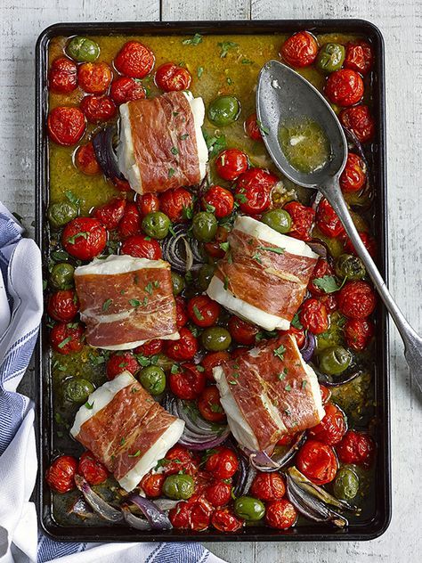 This recipe for cod, cherry tomato and green olive tray roast is so quick and easy to prepare but looks impressive when you pull it out of the oven. Serve with a big bowl of buttered orzo. Cod Loin Recipes, Easy Baked Fish Recipes, Olive Tray, Fish Dinners, Fish Recipes Baked, Tray Bake Recipes, Olive Recipes, Parma Ham, Cod Recipes