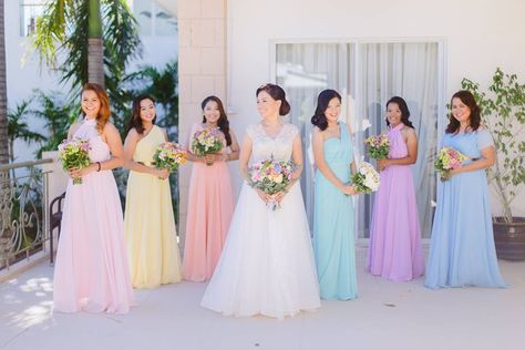 Pretty pastel wedding of Mark and Ann! <3  Photo: Geo | Anne Concepts Gown: Lord Maturan Coordination: Perfect Stories Weddings and Events by Cathy Bacay Flowers and Styling: First of April         #wedding #weddingsph #cebuweddings #philippineweddings #bride #bridesph #couple #groom #groomsph #styling #flowers #cebuweddingstylist #flowers #floralbouquet #bouquet #bridalbouquet #FOAFlowers #firstofapril Wedding Pastel Bridesmaid Dresses, Pastel Colours Wedding Theme, Rainbow Pastel Wedding Theme, Pastel Colour Wedding Decoration, Pastel Colour Gowns, Pastel Fall Wedding Colors, Bridesmaid Dresses Pastel Colours, Pastel Colour Wedding Theme, Mixed Pastel Bridesmaid Dresses