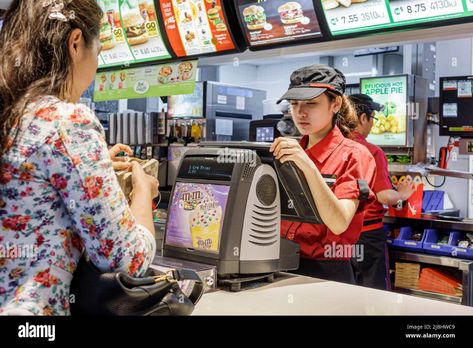 Download this stock image: Sydney Australia,Circular Quay,McDonald's restaurant fast food counter ordering,Asian female employee worker working taking order customer paying - 2JBHWC9 from Alamy's library of millions of high resolution stock photos, illustrations and vectors. Fast Food Worker, Fast Food Workers, Food Counter, Mcdonald's Restaurant, Order Food, Image Processing, How To Speak Spanish, Sydney Australia, My Images