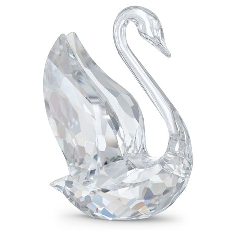 This medium-sized decoration piece is inspired by the new Swarovski Swan logo. Designed by Martin Zendron, it is crafted purely from clear crystal with 299 facets, with the Swan's head and neck shaped to form an elegant 'S' for Swarovski. Looking towards the future, with its wings lifted and ready for take-off, this beautiful design celebrates the brand's unique craftsmanship and heritage in a modern and sophisticated way. Decoration object. Not a toy. Not suitable for children under 15. Home Decorate Ideas, Glamor Photography, Pink Thing, Sky Paintings, Crystal Store, Table Pieces, Charmed Ones, Swarovski Swan, Genshin Oc