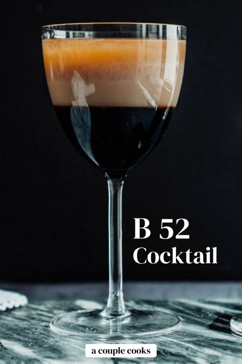 Here's how to make the B 52 cocktail, aka B52 shot! Layered Kahlua, Irish cream, and Grand Marnier make the perfect sip. #b52 #b52shot #b52cocktail #easy #kahlua #baileys #baileysirishcream #grandmarnier #cocktail #party #shot