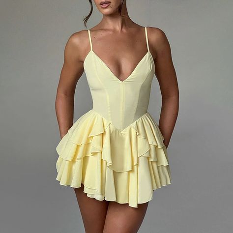 Light yellow playsuit.  
 Lined. 
 Cold hand wash only. 
 True to size. 
 Lightweight, non-stretchy woven fabric. 
 Invisible back zipper. 
 Polyester. 
 
 Ease on down Canary Road with this soft and lovely playsuit. This piece is packed with dainty details making it iconic! This daytime brunch playsuit showcases a frilled hemline to the bottom, a tie feature to the front and a tie to the back.  Pair this dress with strappy heels and soft curls. Backless Slip Dress, Tiered Sleeve, Party Gown Dress, Sleeveless Skirt, Looks Party, Pleated Mini Dress, Backless Mini Dress, Solid Color Dress, Mini Dresses For Women