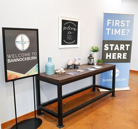 Welcome Desk Church, Church Connection Center, Church Entryway Decor Foyers, Church Welcome Table, Welcome Center Church Ideas, Church Foyer Decor, Church Lobby Ideas, Church Lobby Design Foyers, Church Lobby Decor