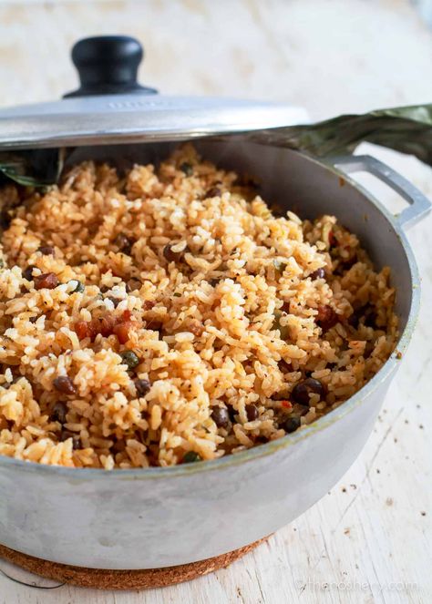 Dec 22, 2017 - Arroz con gandules is a savory rice with pigeon peas. It's traditionally served in Puerto Rico during Christmas but, appreciated year round. Arroz Con Gandules Puerto Rican, Puerto Rican Roast Pork, Rice With Pigeon Peas, Rice And Pigeon Peas, Puerto Rican Style, Coconut Rice Pudding, Taro Root, Puerto Rican Cuisine, Puerto Rican Dishes