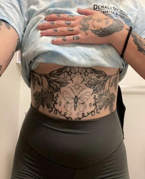 Stomach Pieces Tattoo, Sternum And Stomach Tattoo Women, Colorful Stomach Tattoos, Stomach Tattoo Outline, Neotrad Stomach Tattoo, Asymmetrical Stomach Tattoo, Tummy Tattoo Plus Size, Halloween Stomach Tattoo, Moth Stomach Tattoos Women