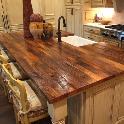 A refined rustic kitchen adds an authentic island top made from reclaimed oak. The surface texture retains original saw marks and rustic patina. | #rusticislandtop #woodislandtop #reclaimedisland #reclaimedwoodtop #reclaimedcountertop #farmhousedecor #rustickitchen Wood Countertops Kitchen Island, Wooden Countertops Kitchen, Reclaimed Wood Kitchen Island, Wood Countertops Kitchen, Reclaimed Wood Kitchen, Wooden Countertops, Rustic Kitchen Island, Wood Kitchen Island, Island Countertops