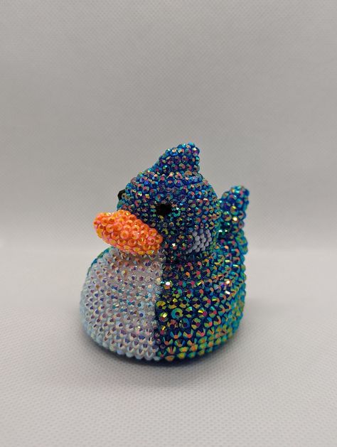 Shark rhinestone rubber duck. A perfect gift for yourself or your favorite off-road enthusiast! Each rhinestone is hand-placed. Duck is approximately 3 in. x 3 in. You may notice an odor coming from the duck. It is from the extra-strength glue used to place the rhinestones. Leave the duck in a well-ventilated area, and the smell will dissipate in a few days. *If you plan to keep the duck in a vehicle, keep an eye on it when it is hot outside. Rubber ducks are known to melt or misshapen in hot te Duck Things, Bedazzled Things, Duck Collection, Bling Ideas, Cute Dreads, Rubber Duckies, Rhinestone Projects, Hot Outside, Rubber Ducks