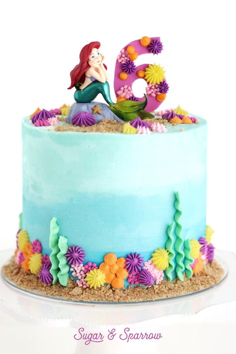 An Ariel-themed birthday cake for my 6 year-old niece. Featuring Under The Sea buttercream | Sugar & Sparrow | #thelittlemermaidcake #arielcake #littlemermaidcake #disneycake #birthdaycakes #cakedesign #partycakes #undertheseacake Ariel Mermaid Cake, Mermaid Cake Design, Mermaid Birthday Cake Ideas, The Little Mermaid Cake, Birthday Cakes Girls Kids, Little Mermaid Birthday Cake, Mermaid Birthday Cake, 6th Birthday Girls, Ariel Cake