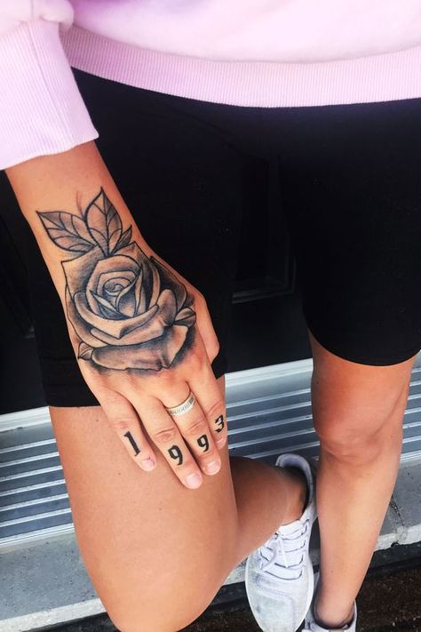 Black and Grey Rose Hand Tattoo with Script, hand tattoos rose Tattoo Ideas Female Hand Rose, Hand Roses Tattoo, Rose Tattoo On Hand For Women, Rose Hand Tattoo Woman, Hand Tattoos Rose, Rose Tattoo Ankle, Simplicity Tattoos, Butter Tattoo, Cover Ups Tattoo