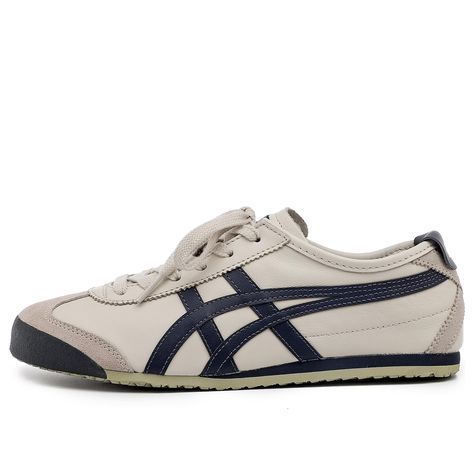 Introducing the Onitsuka Tiger MEXICO 66, a retro-inspired update on a classic sneaker. This sneaker is perfect for those who want to channel their inner '68 Olympian or simply add a touch of retro style to their everyday looks. The leather upper, suede paneling and serrated eyestays are reminiscent of the original design, while the contrast labels and midfoot stripes give the shoe a modern twist. The two-tone rubber sole is reissued with classic rubber tread, making this sneaker both stylish an Mens Lifestyle Shoes, Mens Skater Fashion, Men’s Sneakers, Mexico 66 Onitsuka, Onitsuka Tigers, Preppy Sneakers, Tiger Sneakers, Dress Sneakers, Everyday Shoe