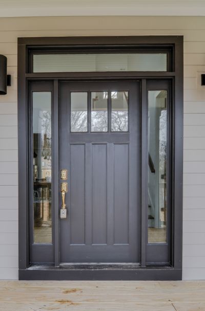 31 Houses With Black Front Entry Door Ideas - | Sebring Design Build Sherwin Williams Black Magic, Sherwin Williams Black, Craftsman Exterior Door, Craftsman Front Door, Exterior Doors With Sidelights, Front Door With Sidelights, Craftsman Front Doors, Door With Sidelights, Black Exterior Doors