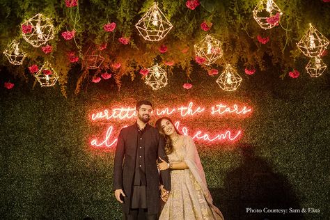 25+ neon signs to brighten up your wedding festivities | Planning | WeddingSutra Neon Signs For Weddings, Wedding Neon Sign Ideas, Sangeet Setup, Catering Branding, Couple Seating, Farm Hotel, Stage Backdrops, Engagement Stage, Engagement Stage Decoration