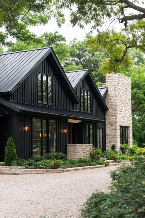 Black long house with stone details surrounded by greenery. Long houses — where stretching out means more than just a good night’s sleep—it’s an adventure in architectural sprawl! Small Black House, Long Houses, Black Houses, Farmhouse Architecture, Stone Chimney, Modern Backyard Landscaping, Long House, Suburban House, House Blend