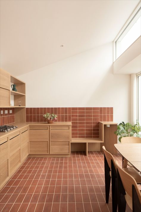 Ketley red quarry tiles, with a vanilla grout. Laid in stack bond on the floor and wall of a kitchen, with smooth wooden kitchen units and wooden kitchen table. Kitchen Flooring Tile, Red Tile Floor, Terracotta Kitchen, Brick Interior, Quarry Tiles, Brick Detail, Terracotta Floor, Brick Flooring, Brick Tiles