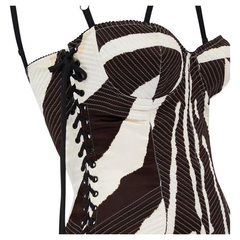 This dress is from Dolce & Gabbana's highly glamorous main line circa 2003. Flaunting many of the fashion house's beloved signature details, we love the underwear-as-outerwear design and sensuous lace-up sides. Tailored from smooth silk with a hint of stretch, it is printed all over with a zebra print design in off-white and darkest brown. The top forms a bustier and is held up by adjustable bra-like straps. The sides of the dress are detailed with black eyelets interwoven with black laces. The Summer 24 Fashion, 2024 Fits, Jersey Evening Dress, Silk Corset, Ny Outfits, Dolce And Gabbana Handbags, Oc Outfits, New Look Fashion, Zebra Print Dress