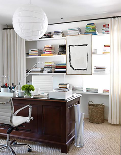 These tips for hiding clutter on shelves are the BEST! I love that I can still use my bookcases for storage but they look so much prettier! #2 is my favorite! Definitely pinning for later! #shelves #organizing #clutter #storage | 9 Easy Ways To Hide Clutter On Shelves (picture from House Beautiful) Hanging Curtain Rods, Office Shelf, Small Home Office, Office Room, Hanging Curtains, Home Office Design, Home Office Decor, Curtain Rods, Office Design