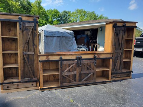 tv entertainment stand , entertainment center, tv stand .Rustic furniture . Farmhouse furniture . Country furniture  Picture shown  7ft tv stand 2 book cases..34in front With sliding doors and drawer  Please leave phone number when ordering for the driver to be in contact with you on day and time of delivery.  PICK UP 60 MINUTES NORTH OF INDIANAPOLIS INDIANA 45 MINUTES SOUTH OF FORTWAYNE,INDIANA SHIPPING CAN NOW BE PROVIDED WHEN ORDERED BY SELECTING IN THE VARIATION BAR.. THAT YOU WANT IT SHIPPED. SHIPPING FEES DUE APPLY... AND INVOICE WILL BE SENT OR CUSTOM ORDER MADE DEPENDING ON YOUR LOCATION.. SHIPPING FEES VARY PLEASE CONTACT ME ON YOUR LOCATION OF THE SHIPPING FEES BEFORE PURCHASING USING THE VARIATION BAR PICK UP...no shipping fee SHIP EXTRA FEE APPLY.. WHEN CHOOSING TO SHIP a invoi Tv Display Cabinet, Homemade Tv Stand, Rustic Bar Cabinet, Home Decor Tv, Furniture Picture, Barn Door Cabinet, Farmhouse Storage Cabinets, Rustic Farmhouse Furniture, Barn Door Tv Stand