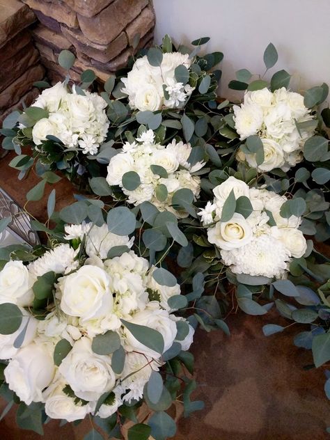 White bridal and bridesmaid bouquets with playa blanca roses, china mums, hydrangea, and bridal white mini carnations, and eucalyptus greens White Rose And Eucalyptus Bouquet Simple, Eucalyptus And Carnations Bouquet, Carnation And Eucalyptus Bouquet, White Carnations And Eucalyptus, White Rose And Carnation Bouquet, Carnation Eucalyptus Bouquet, White Roses And Carnations Bouquet, Hydrangea And Carnation Bouquet, Mini Carnation Bouquet