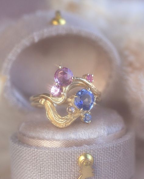 Azure, Rosy Whimsy, and a custom Azure Ring. Customize your stack with whimsical brushstroke designs. #finejewelry #stackingrings #goldrings #sapphirering #uniquejewelry #statementpiece #conversationpiece #brushstrokes #painters Fae Jewelry, Whimsical Rings, Whimsical Wedding Ring, Whimsical Ring, Classy Prom, Ring Inspiration, Ring Inspo, Classy Prom Dresses, Ring Stack