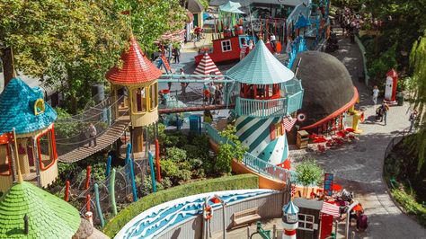 Tivoli Gardens amusement park Copenhagen Tivoli Gardens Copenhagen, Neighborhood Playground, Best Playgrounds, Cool Playgrounds, Red Tricycle, Magic House, Dog School, Tivoli Gardens, Marine Theme