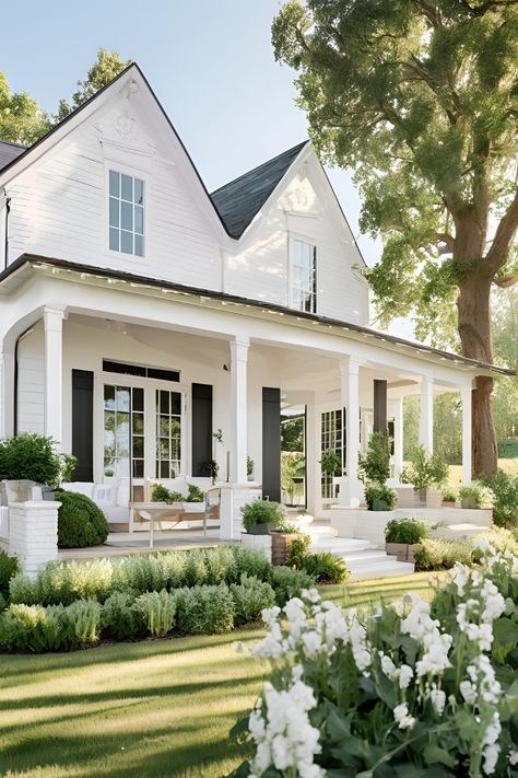 Discover timeless white farmhouse exterior ideas with classic porches, charming shutters, and rustic touches. Perfect for creating a warm and inviting countryside home aesthetic. White Farmhouse Gray Shutters, Charleston Exterior House, Home Exterior Front Porch, White Transitional Home Exterior, White Farmhouse With Shutters, English Cottage Farmhouse Exterior, Classic Southern Home Exterior, White Farmhouse With Wrap Around Porch, Black And White Cottage Exterior