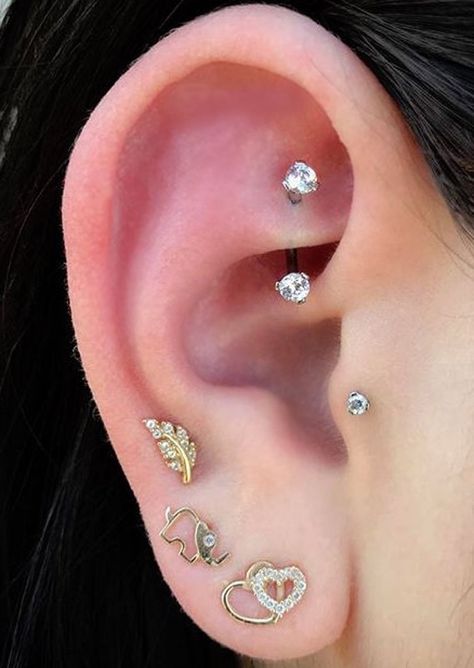 Dainty Ear Piercing Ideas at MyBodiArt.com - Rook Daith 16G Barbell Earring Piercing Snug, Different Ear Piercings, Unique Ear Piercings, Ear Piercings Chart, Lip Jewelry, Double Ear Piercings, Multiple Ear Piercing, Ear Piercings Tragus, Multiple Ear Piercings