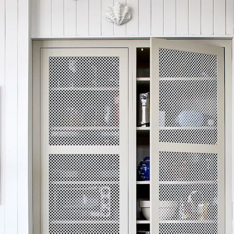 Unique Kitchens and Baths on Instagram: "The perfect little pantry cabinet!  Did you know that we can create any door style and color you desire? This beautiful pantry was created with metal mesh doors painted to match the beautiful drawer boxes. Let us design and build your next kitchen.  Cabinetry @uniquekitchensandbaths   Interior design @winsomeinteriordesign   Photo @stacyzaringoldberg" Metal Mesh Cabinet Doors, Beautiful Pantry, Mesh Doors, Caravan Interior, Mesh Door, Upper Cabinets, Drawer Box, Pantry Cabinet, Unique Kitchen