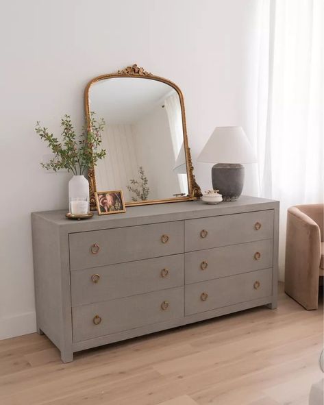 Vintage Gold Mirror Bedroom, White Dresser Gold Mirror, Vintage Mirror Over Dresser, How To Decorate Dresser With Mirror, Grey And Gold Furniture, Brass Bedroom Decor, Grey Dresser Bedroom Ideas, Gold Mirror Dresser, Arch Mirror On Dresser