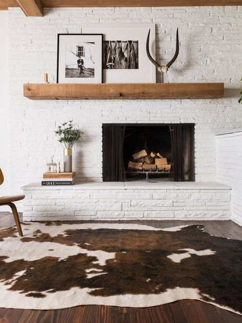 Asymmetrical Fireplace Asymmetrical Fireplaces, Modern Carpets Design, Faux Cowhide Rug, Faux Hide Rug, Modern Fireplace, Painted Brick, Family Room Design, Cow Hide Rug, Living Room With Fireplace