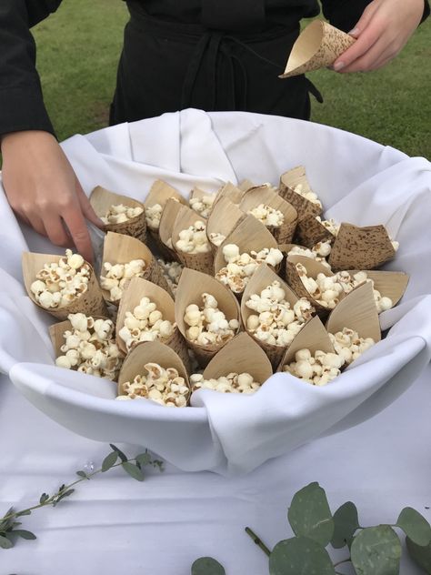 Tempt your wedding guests with popcorn to enjoy while they wait for you to come down the aisle.  #wedding #weddingceremony #popcorn #weddingdetails Popcorn Wedding Ceremony, Wedding Table Snacks Receptions, Pre Ceremony Snacks, Savory Wedding Snacks, Popcorn At Wedding, Cheap Cocktail Hour Food, Wedding Ceremony Snacks, Wedding Snacks Appetizers, Wedding Snacks Ideas